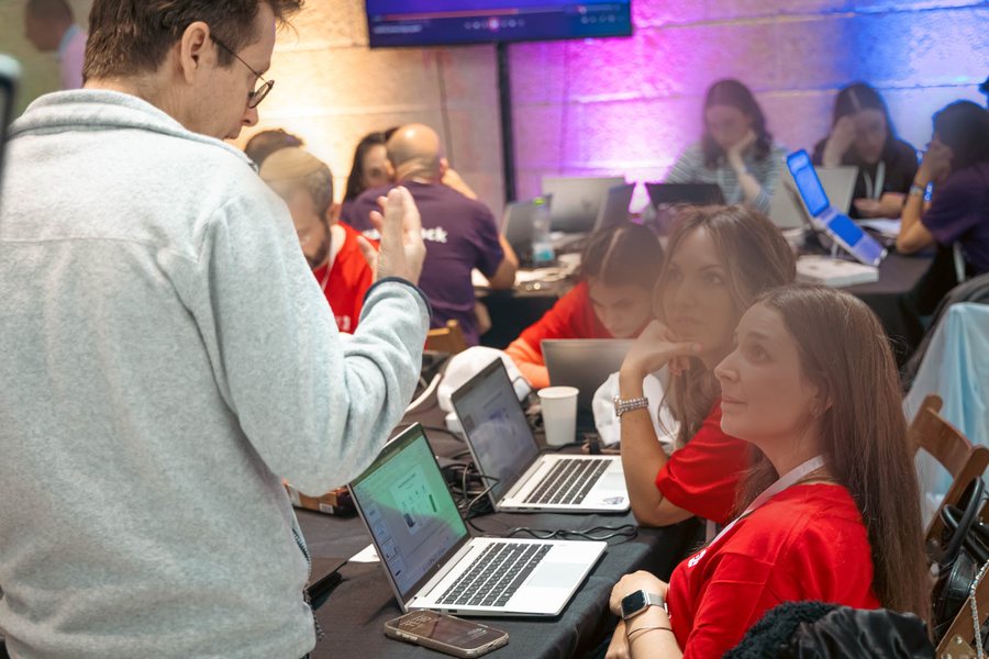 Teams working at their tables during the hackathon
